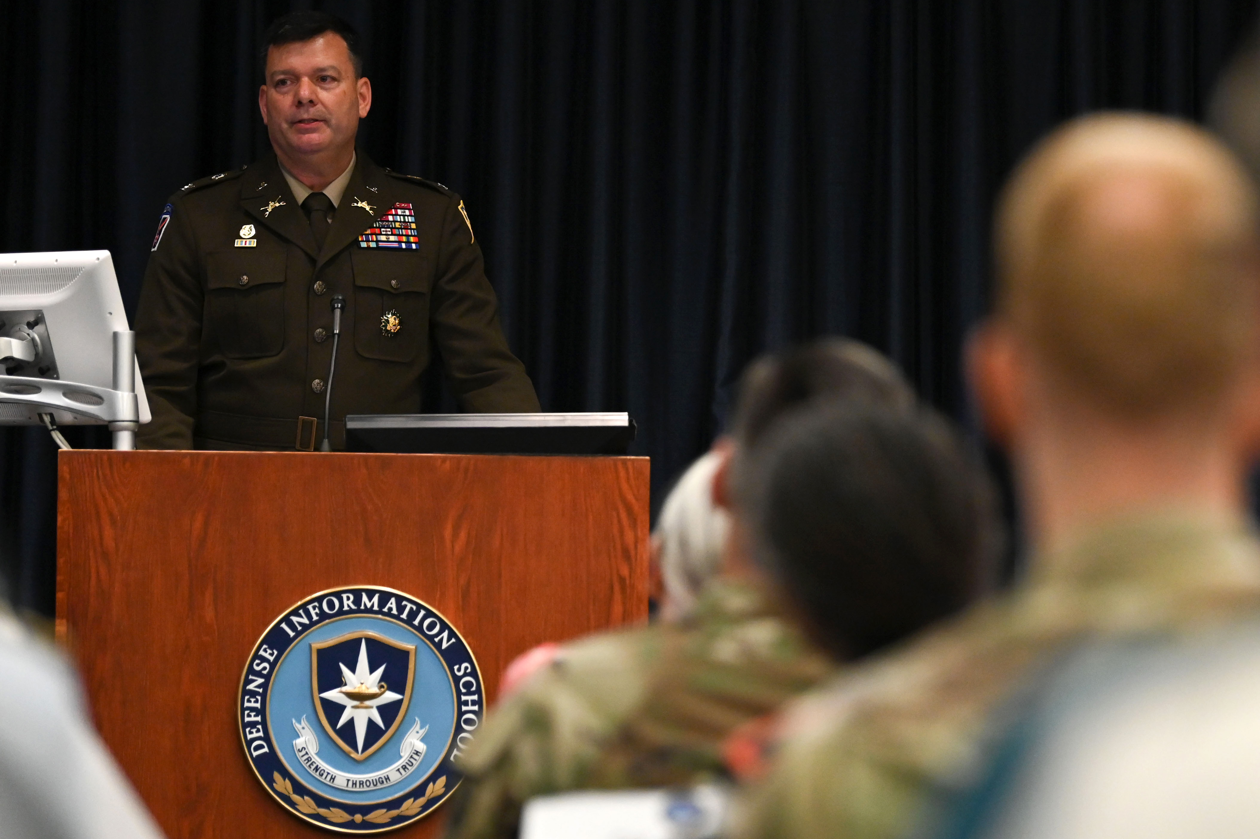 Image of DINFOS Commandant speaking at a graduation